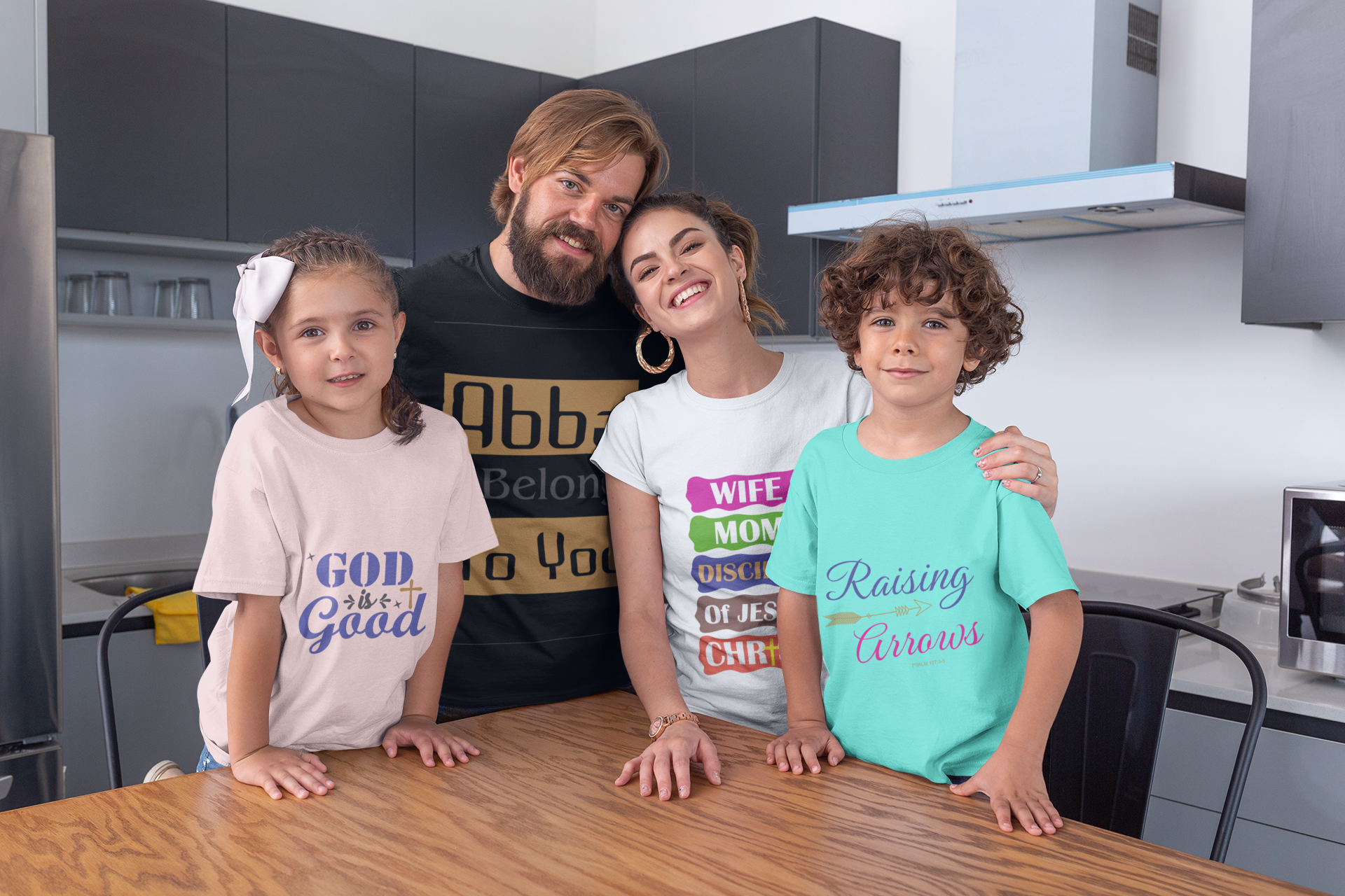 mockup-of-a-family-of-four-wearing-t-shirts-at-the-dining-room-28056.png
